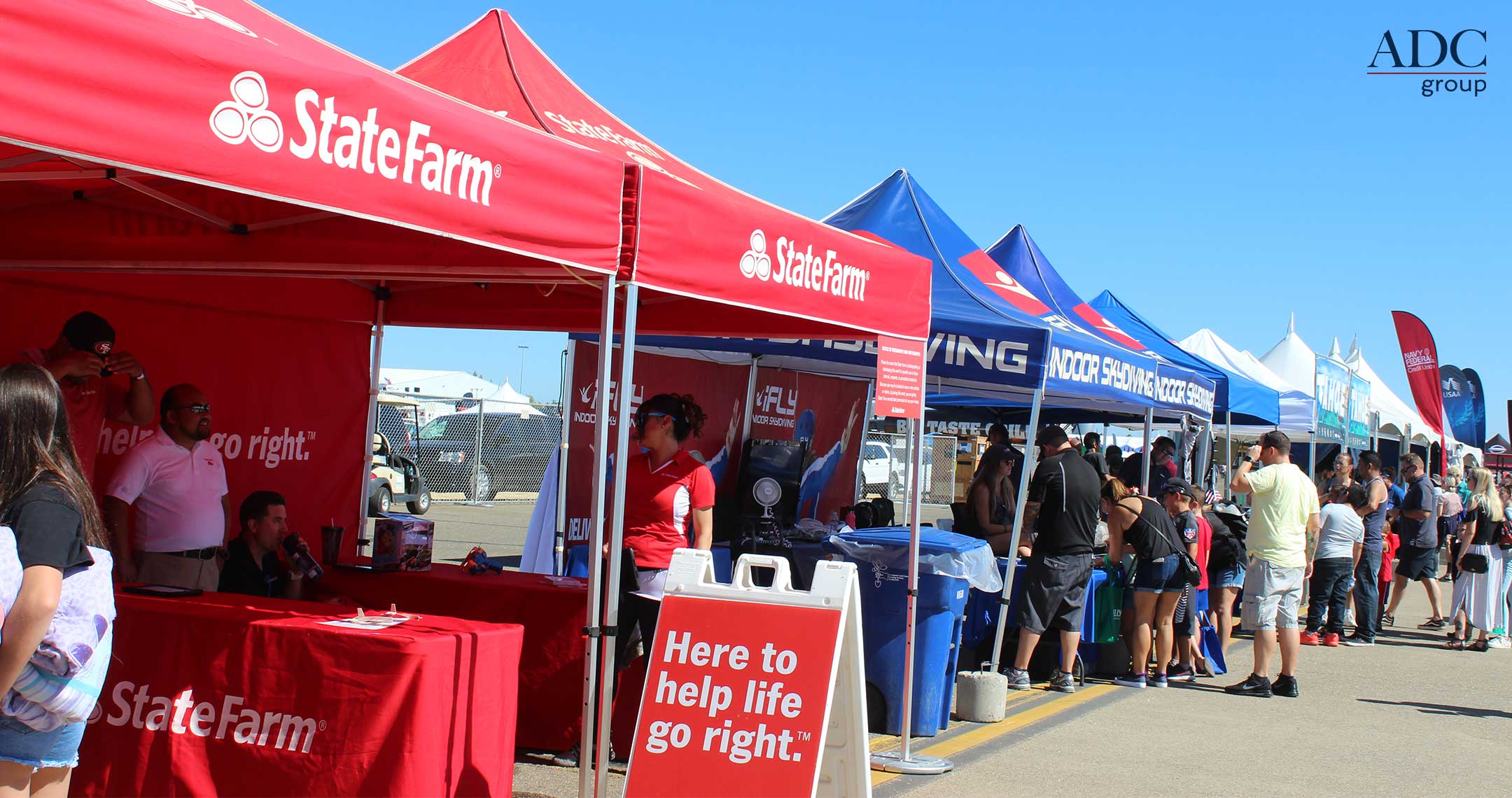 people looking at exhibits during an air show