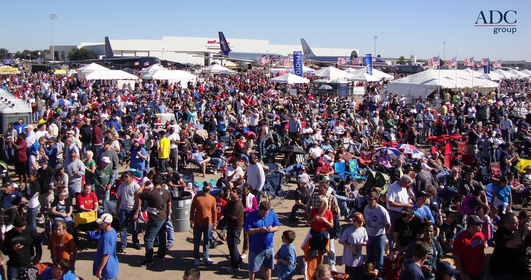 crowd enjoying air show on beautiful day at Fort Worth Alliance Airport